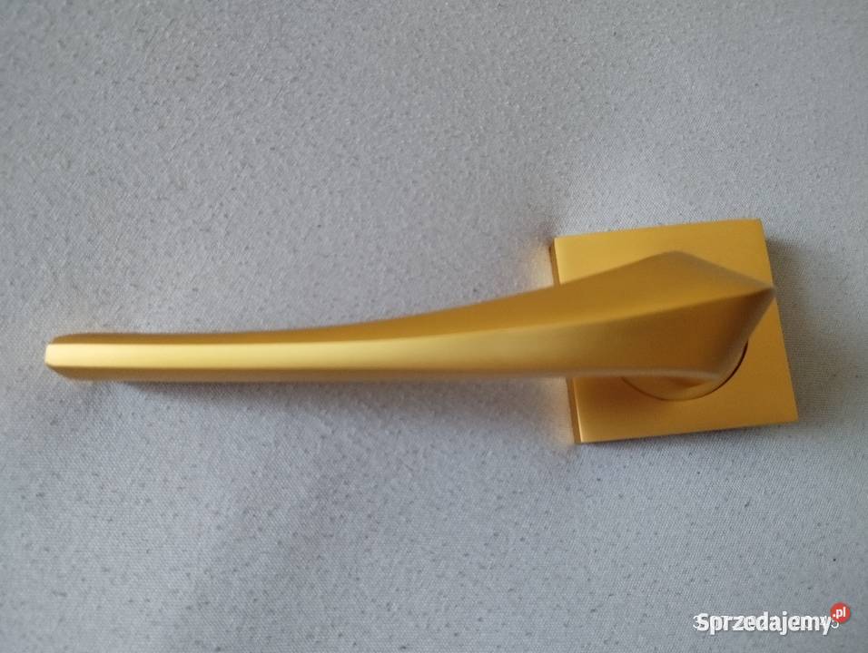 Klamka Adel na rozecie złoty mat Domino Szyld Olsztynek