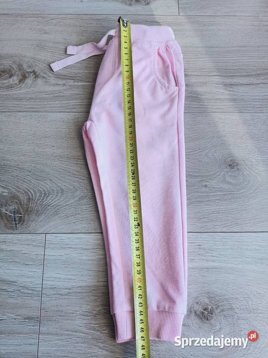 Spodnie dziewczęce dresowe sportowe różowe 92 Płock