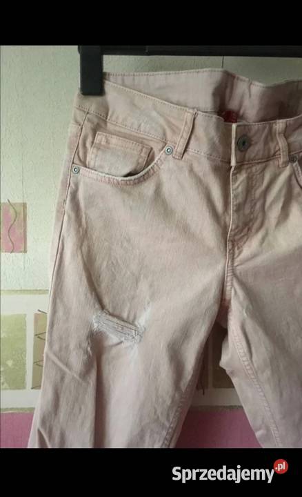 HM spodnie dżinsowe zEfektem postarzenia Dziury H&M