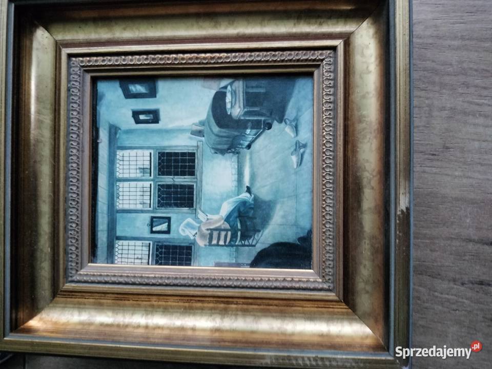 Mały obraz w złoconej ramię kobieta czytająca