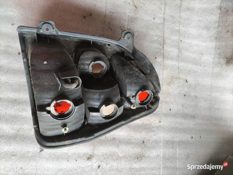 KIA CARNIVAL I LAMPA TYŁ TYLNA LEWA lampy tylne Kamień-Kolonia