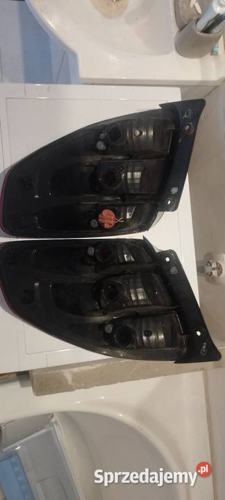 Lampy tył SUZUKI SX4 FIAT SEDICI 0614 Szewna