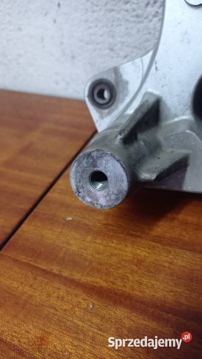 Wspornik koła mocowanie tłumika skuter SYM 250