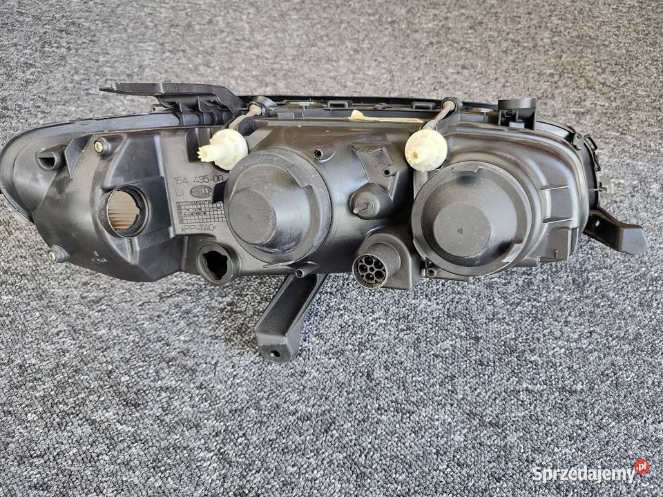Reflektor Opel Omega LIFT H1 Hella Europa lampa Kielcza