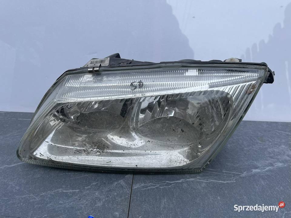 NISSAN ALMERA LEWY KLOSZ ORYGINAŁ Lampy przednie Ostroróg