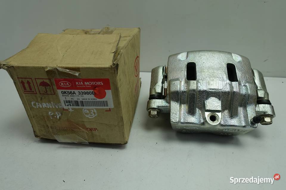 Kia Carnival I 29 CRDI PRZEDNI ZACISK HAMULCOWY Rudka