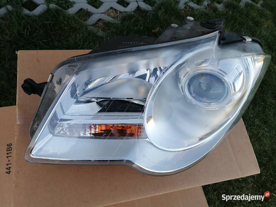 Reflektor Vw Touran 1lift lewy biala ramka osobowe Bąkowice