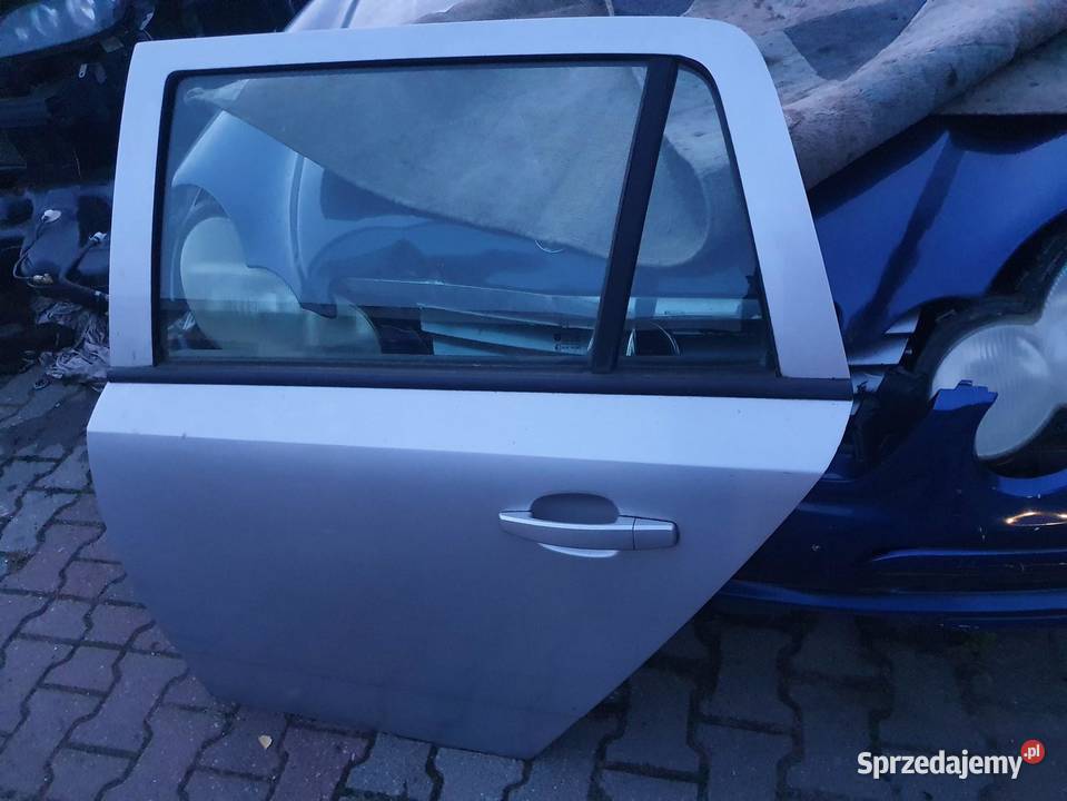 DRZWI LEWY TYŁ OPEL ASTRA III H KOMBI SREBRNE