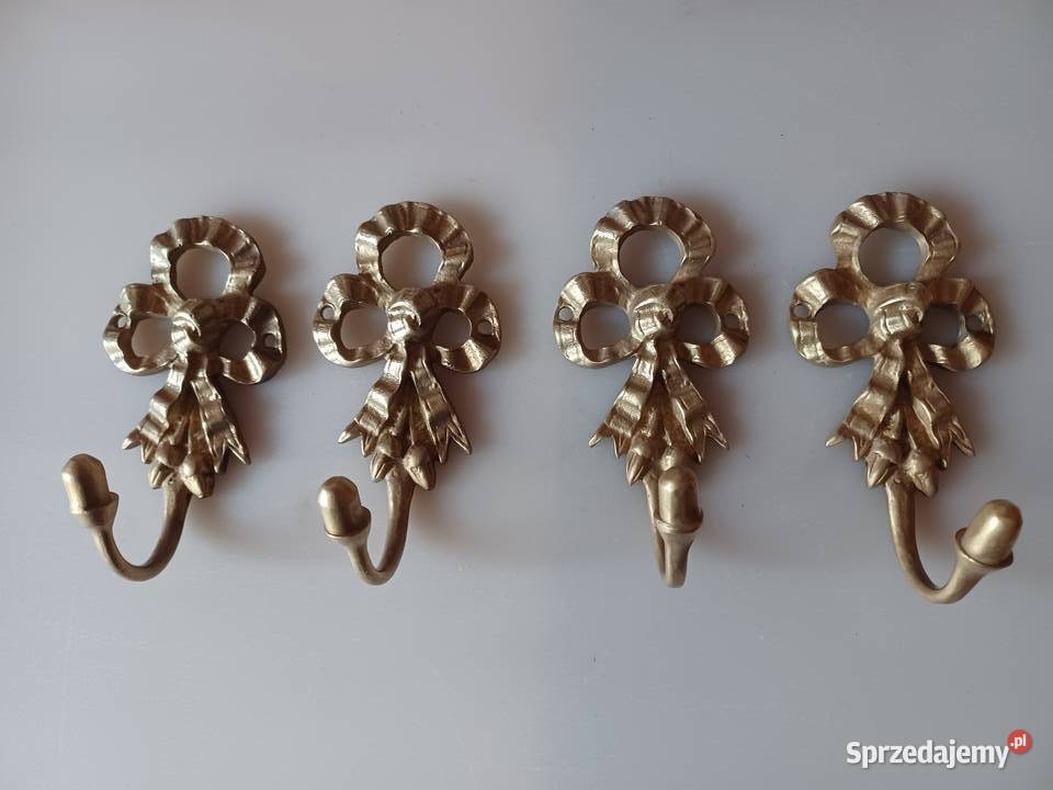 Komplet czterech pięknych mosiężnych wieszaków Poznań sprzedam