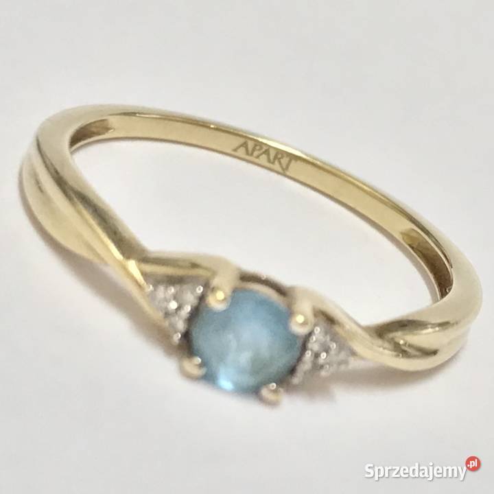 Złoty pierścionek 9K 375 z błękitnym topazem i Warszawa