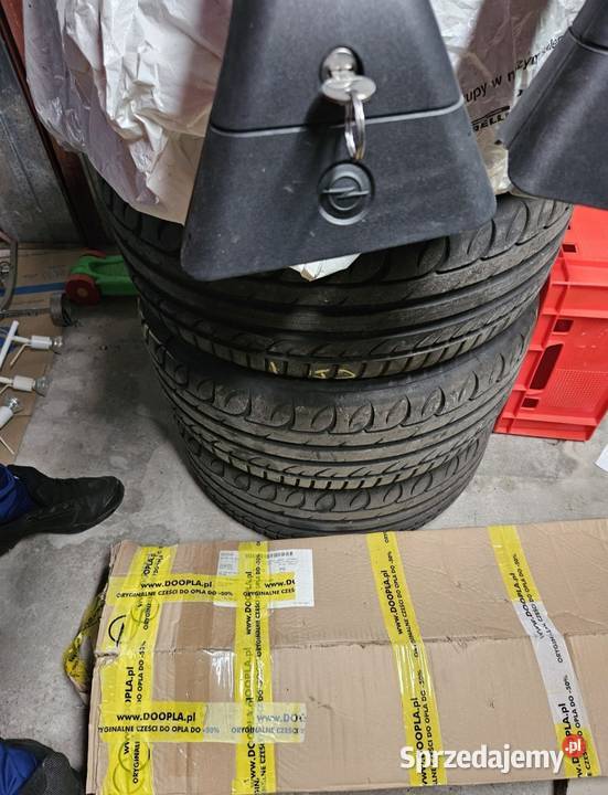 Oryginalne belki bagażnik dachowy Opel Astra J Siennica