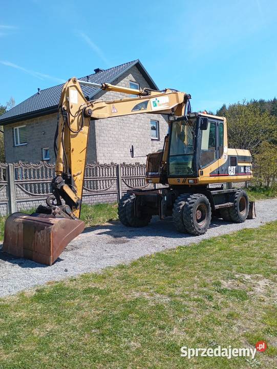 Cat 315 umowa koparka kołowa Koła Pilica