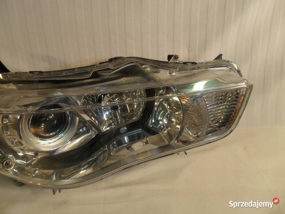 LAMPA PRAWY PRZÓD REFLEKTOR XENON EU MITSUBISHI osobowe Lampy przednie