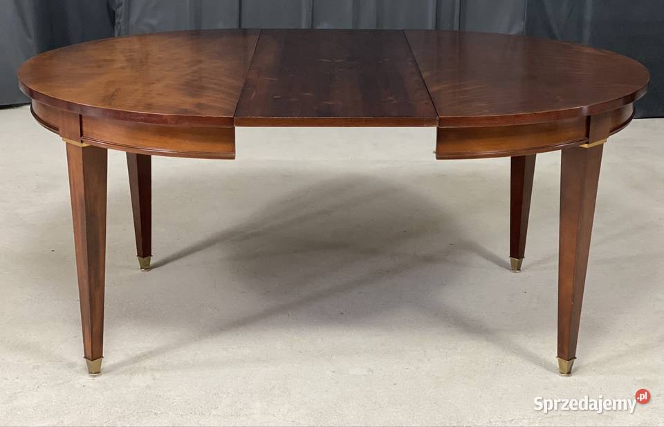 Okrągły mahoniowy stół rozkładany z mosiężnymi