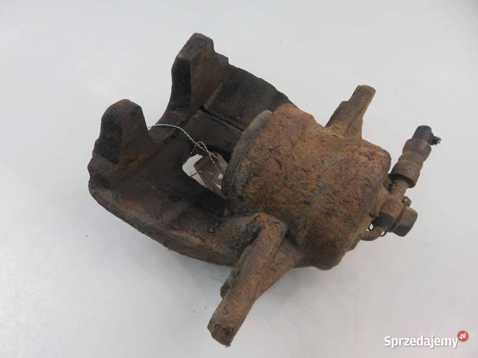 ZACISK LEWY PRZÓD TOYOTA AVENSIS II 20 D4D