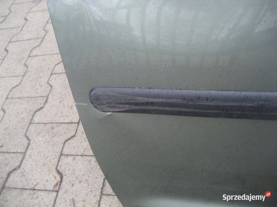 vw caddy 0314r drzwi przód lewe uszkodzone wielkopolskie