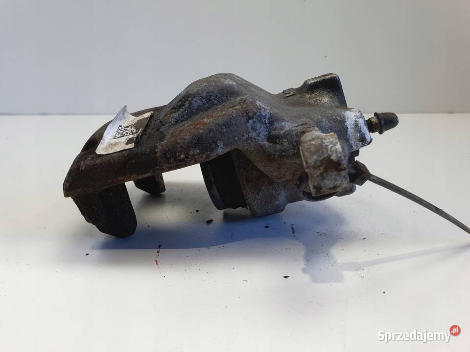 Toyota Corolla XII E21 PRZEDNI ZACISK HAMULCOWY Rudka