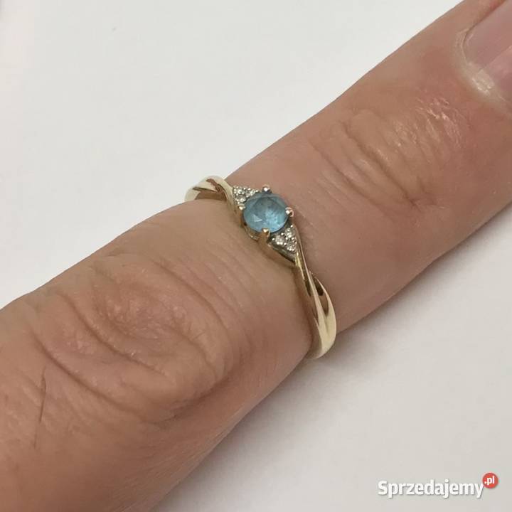 Złoty pierścionek 9K 375 z błękitnym topazem i Warszawa sprzedam