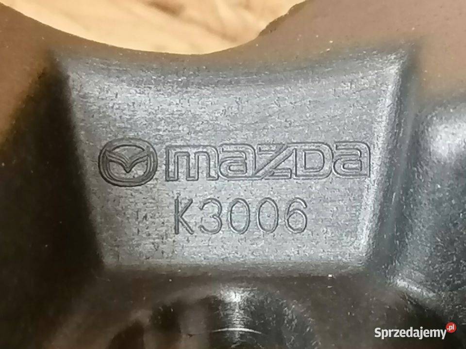 MAZDA 3 14 WSPORNIK HALOGENU PRAWY BHR151684A osobowe Pozostałe Pleszew