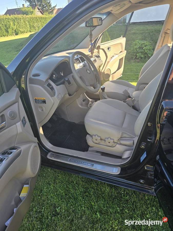 KIA SPORTAGE II 20 140 ACTIVE JASNE SKÓRY skórzana tapicerka Goździk