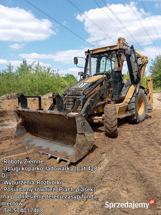 Usługi koparkoładowarką Cat 428D Pustków
