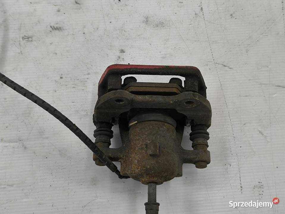 ZACISK HAMULCOWY LEWY TYŁ BMW E90 20i