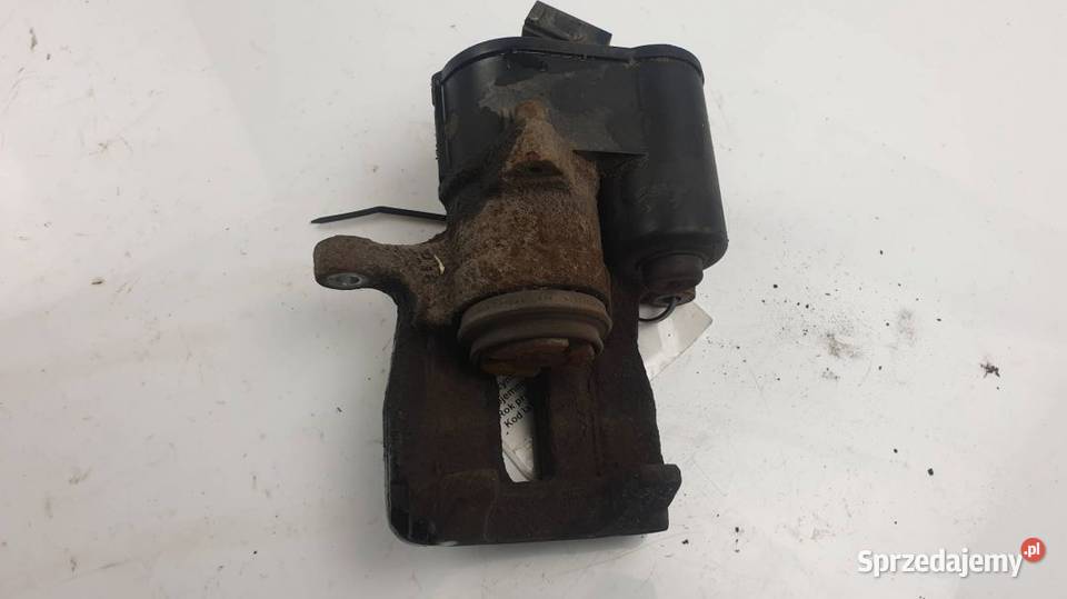 ZACISK HAMULCOWY TYŁ PRAWY 32332267K PASSAT B7 osobowe