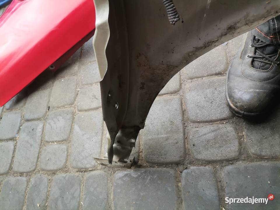 NISSAN PRIMERA P12 BŁOTNIK LEWY PRZEDNI KY0G Części samochodowe Nowy Sącz