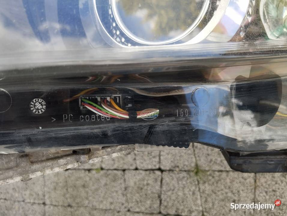 Lampa Opel Astra H III lewy przód BiXenon Kamieniec sprzedam