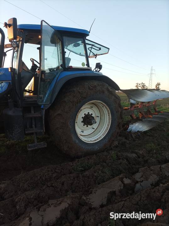 Holland TM 190 Amortyzacja przedniej osi sprzedam