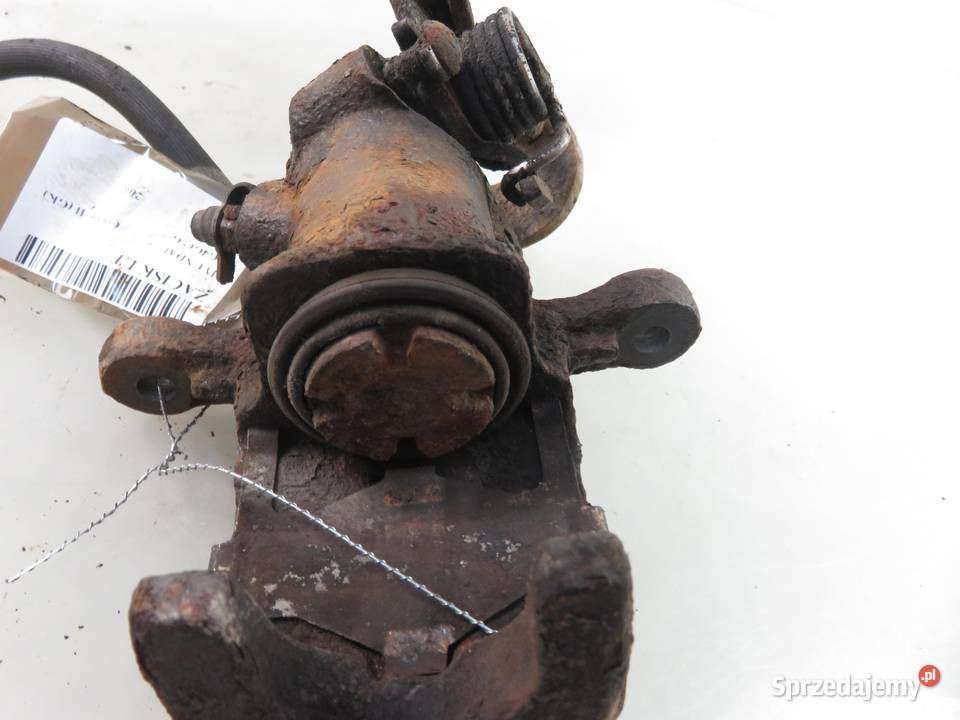 ZACISK LEWY TYŁ HYUNDAI COUPE II 20