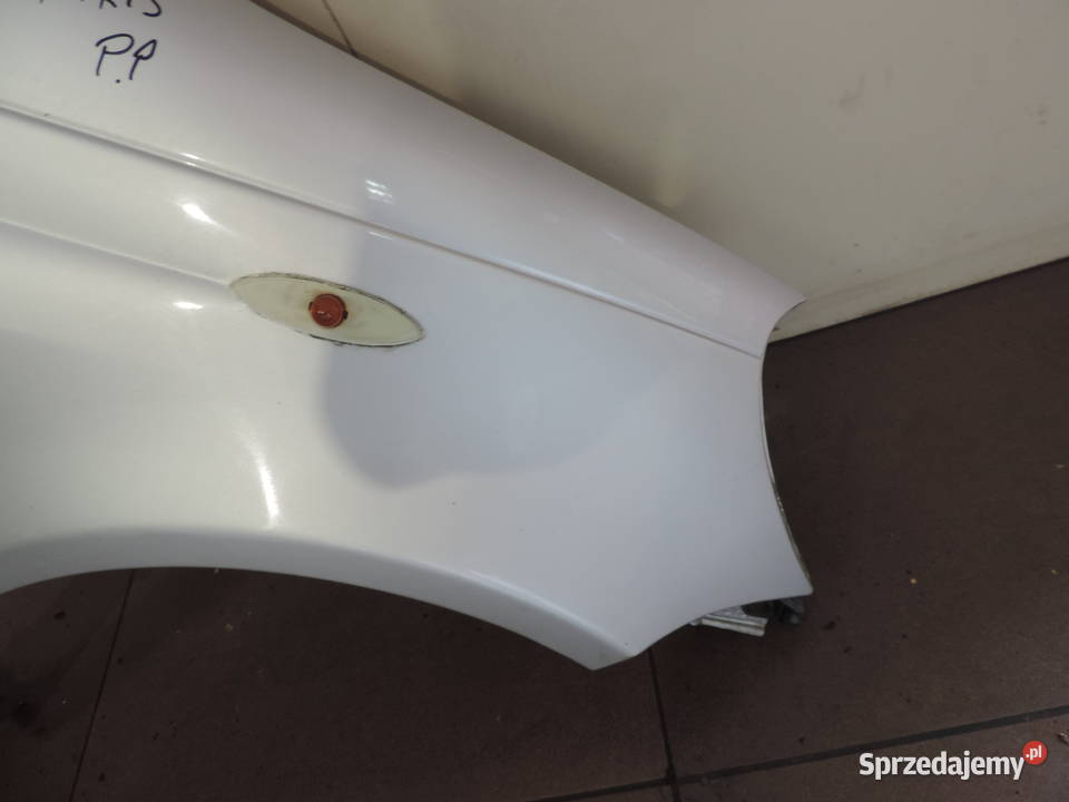 BŁOTNIK PRAWY PRZÓD TOYOTA YARIS 1 FL KOLOR 1E7 Rok produkcji 2004 małopolskie Nowy Sącz