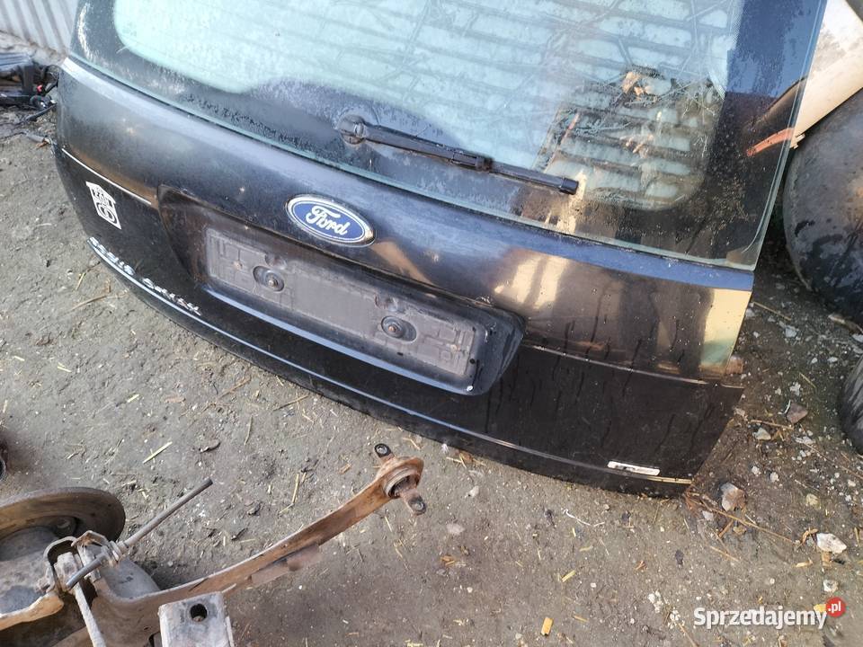 FORD FOCUS C MK1 SZYBA KLAPA BAGAŻNIKA NAPIS osobowe Karoseria Kamień-Kolonia