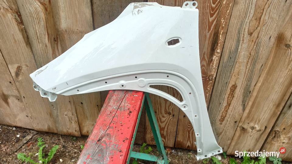 Blotnik lewy przód Aygo X osobowe Pilawa