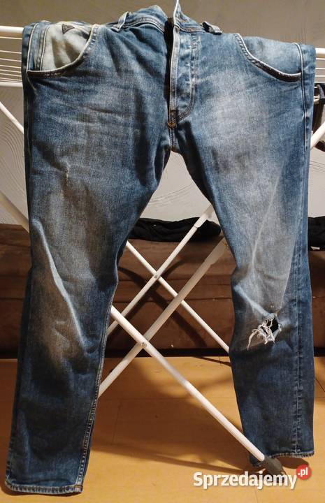 Męskie spodnie jeansowe z dziurą GUESS rozmiar Myszków sprzedam