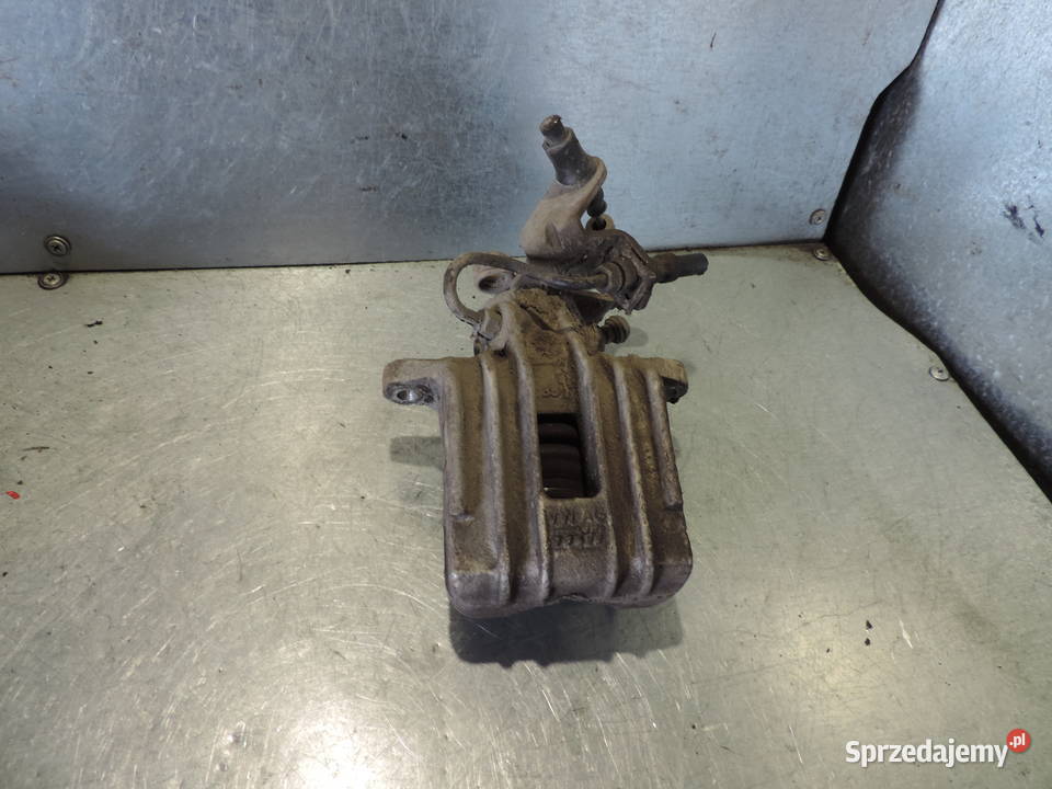 VW GOLF V 19 TDI ZACISK HAMULCOWY LEWY TYŁ