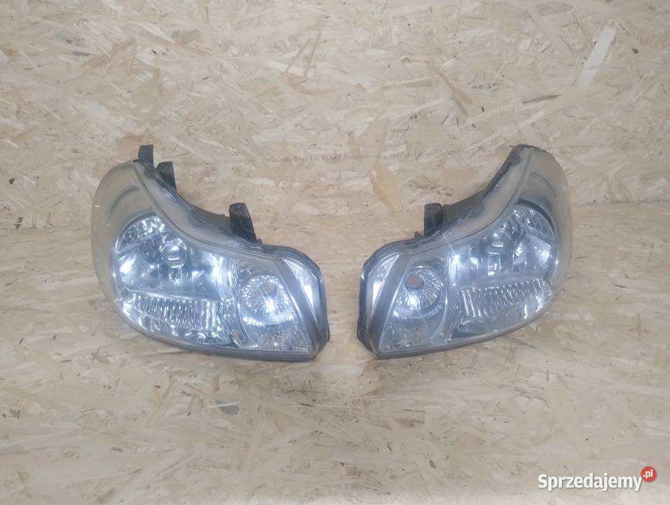 Lampy przód Suzuki SX4 oryginał