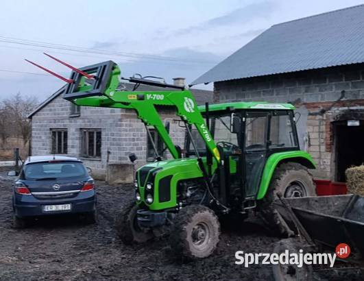 1 ŁADOWACZE CZOŁOWE Z MONTAŻEM METALTECHNIK