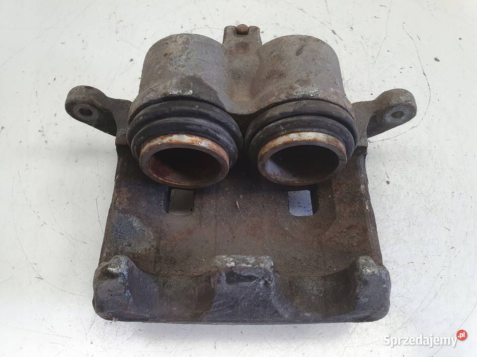 Nissan XTrail T30 PRZEDNI ZACISK HAMULCOWY lewy Rudka