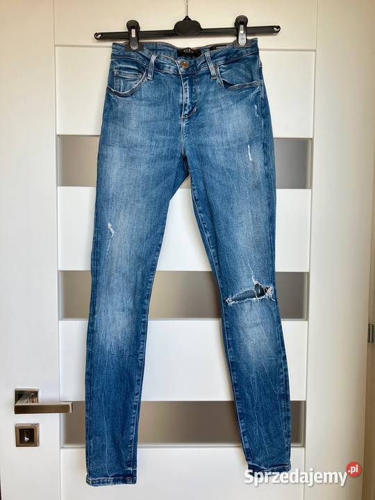Jeansy spodnie damskie Guess skinny rurki Nisko