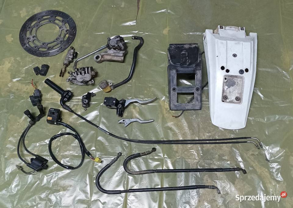 Błotnik lampa cewka WN linka rolgaz pompa zacisk Gołaczewy