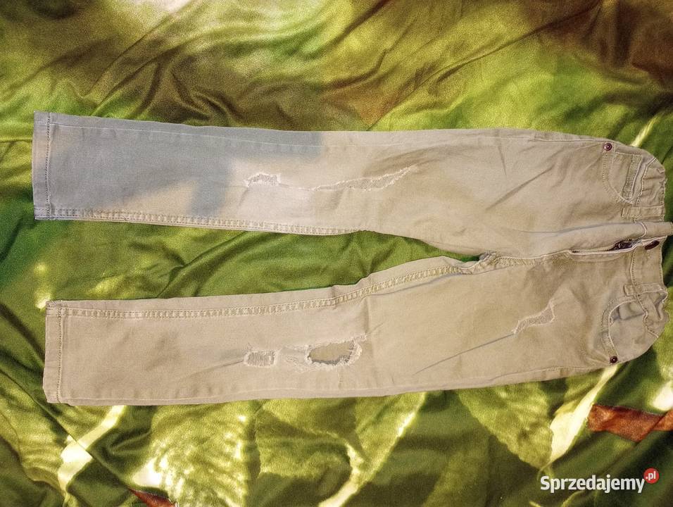 Spodnie skiny khaki dziury 134 Przemyśl