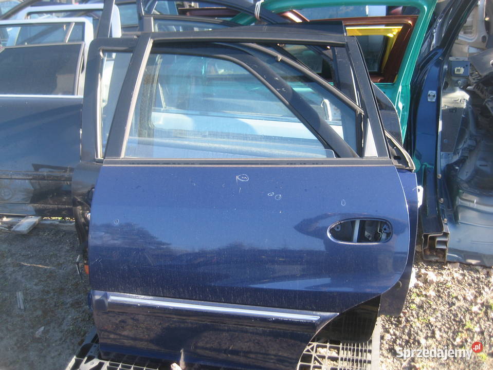 kia carens i 0002r drzwi tył lewe Drzwi Rakoniewice