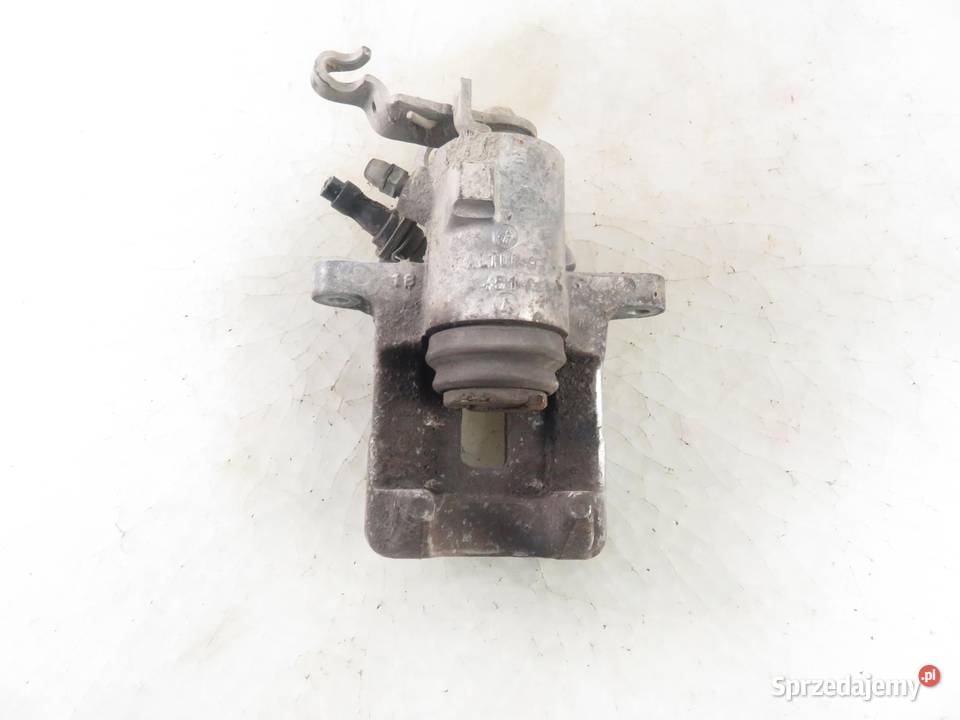 ZACISK LEWY TYŁ AUDI A3 8P 16 Układ hamulcowy sprzedam