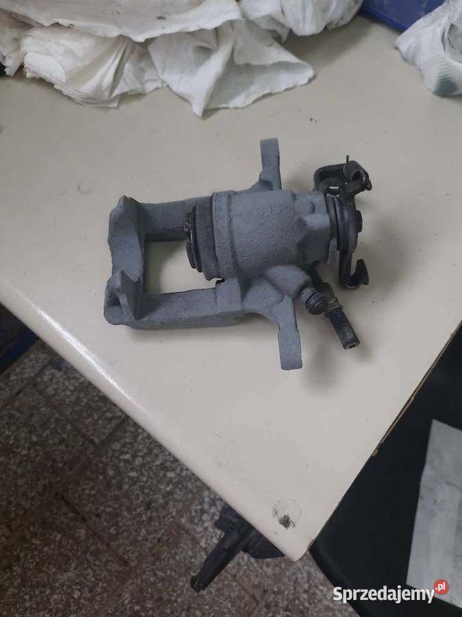 Zacisk lewy tył opel astra j Będzin