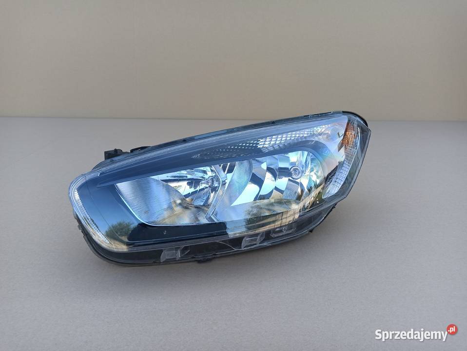 FORD TRANSIT COURIER REFLEKTOR LEWY LAMPA LEWA Trzciel