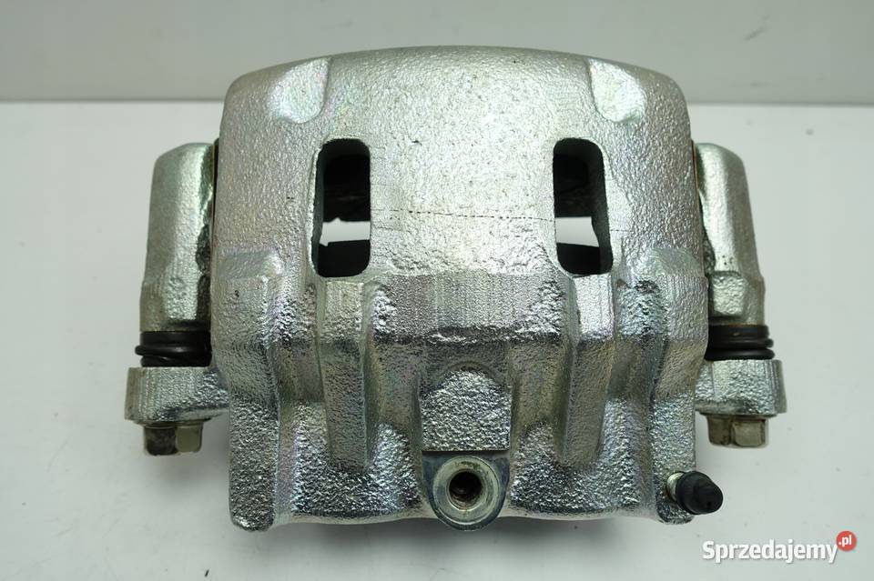 Kia Carnival I 29 CRDI PRZEDNI ZACISK HAMULCOWY Rudka