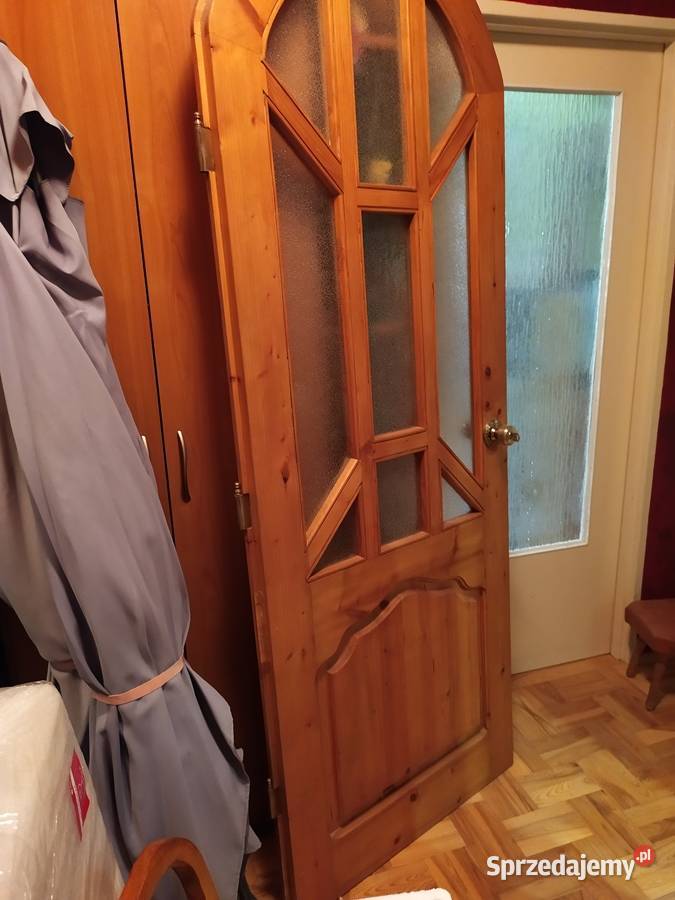 Drzwi z litego drewna z półłukiem robione na Kraków