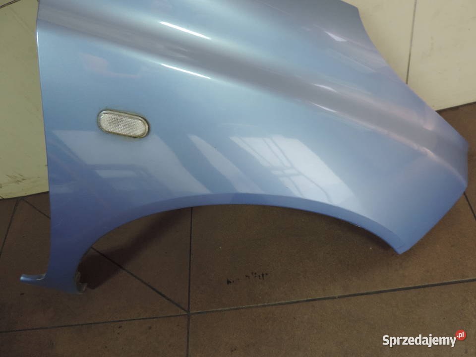 NISSAN MICRA K12 BŁOTNIK PRAWY PRZÓD T12G