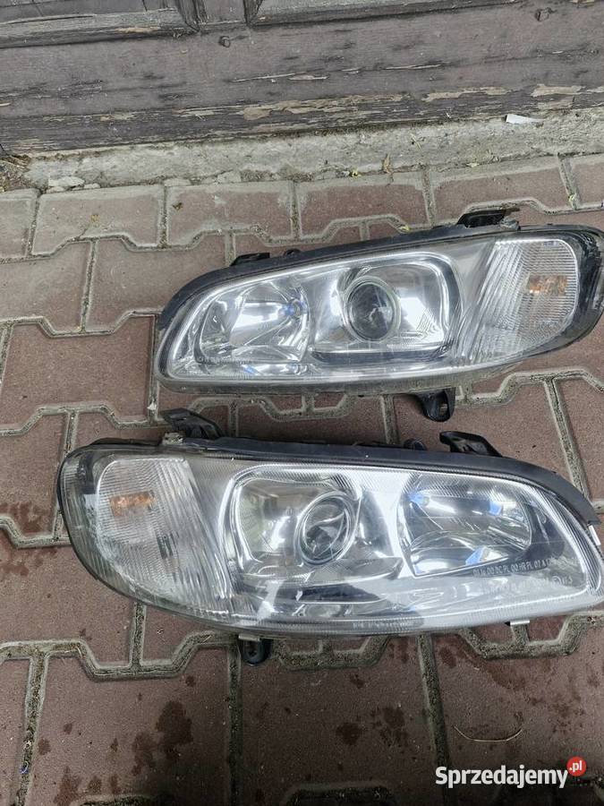 Lampy przednie Opel Omega B FL soczewki